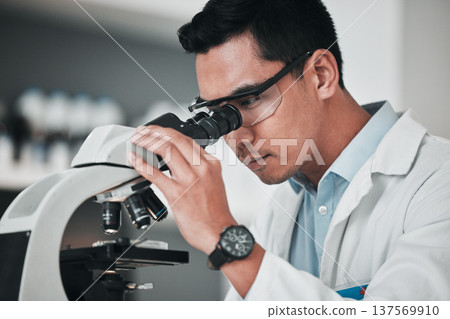 Man, scientist and microscope in forensic science, research or new discovery at laboratory. Male person, medical or healthcare specialist looking in scope for DNA, vaccine or cure to virus in lab 137569910