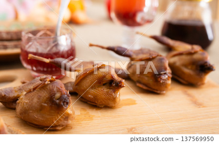Rustic Smoked Game Bird on Wood Background 137569950