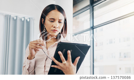 Woman in office, reading and thinking with tablet for email, HR schedule or report online for feedback. Research, networking and communication on digital app, businesswoman at human resources agency. Woman in office, reading and thinking with tablet for email, HR schedule or report online for feedback. Research, networking and communication on digital app, businesswoman at human resources agency. 137570086