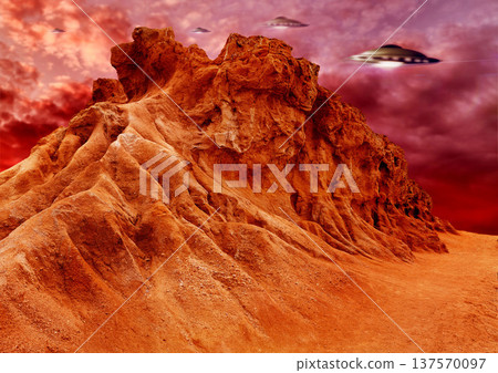 UFO, invasion and spaceship in outer space on mars and planet with science fiction. Alien technology, flying saucer and red mountain landscape with surreal background and world with spacecraft in sky UFO, invasion and spaceship in outer space on mars and planet with science fiction. Alien technology, flying saucer and red mountain landscape with surreal background and world with spacecraft in sky 137570097