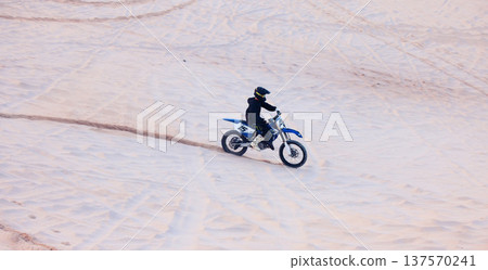 Sand, travel or athlete driving motorcycle for action, adventure or fitness with performance or adrenaline. Desert, sports or person on motorbike on dunes for training, exercise or race or challenge Sand, travel or athlete driving motorcycle for action, adventure or fitness with performance or adrenaline. Desert, sports or person on motorbike on dunes for training, exercise or race or challenge 137570241