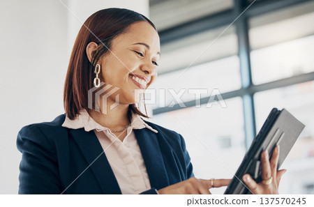 Woman in office with smile, tablet and scroll on email, schedule or report online for feedback. Internet, networking and communication on digital app, happy businesswoman at human resources agency. Woman in office with smile, tablet and scroll on email, schedule or report online for feedback. Internet, networking and communication on digital app, happy businesswoman at human resources agency. 137570245