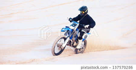 Desert, speed or athlete driving motorcycle for action, adventure or fitness with performance or adrenaline. Sand, fast or sports person on motorbike on dunes for training, exercise or race challenge Desert, speed or athlete driving motorcycle for action, adventure or fitness with performance or adrenaline. Sand, fast or sports person on motorbike on dunes for training, exercise or race challenge 137570286