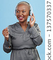 Black woman, headphones and music, dancing and technology with audio streaming isolated on blue background. Listening to radio, wireless tech for podcast and subscription with media in studio 137570337
