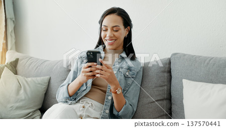 Home, relax and woman with a cellphone, typing and connection with social media, email and post. Person, digital app and girl with a smartphone, search internet and network with contact and smile Home, relax and woman with a cellphone, typing and connection with social media, email and post. Person, digital app and girl with a smartphone, search internet and network with contact and smile 137570441