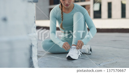Fitness, person or tie sneakers shoelace for exercise, training challenge or race workout, practice or active performance. Running footwear, wellness or urban person prepare shoes for sports marathon Fitness, person or tie sneakers shoelace for exercise, training challenge or race workout, practice or active performance. Running footwear, wellness or urban person prepare shoes for sports marathon 137570667