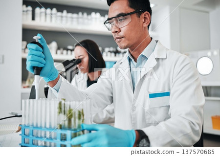Science, research and man with test tube in biotech laboratory, solution for vaccine or medical innovation. Healthcare, lab analytics and medicine, scientist with pharmaceutical sample in container. 137570685
