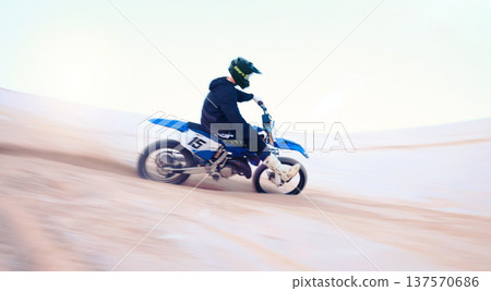 Sports, desert and athlete on motorbike for action, adrenaline and skill training for challenge, Fitness, sand dunes and man biker practicing for race, competition or performance adventure at a rally 137570686