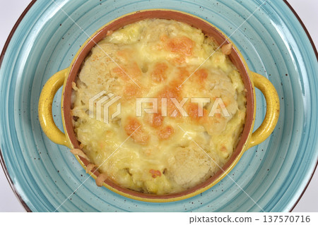 Baked cauliflower and mashed potatoes with cheese in yellow bowl Baked cauliflower and mashed potatoes with cheese in yellow bowl 137570716