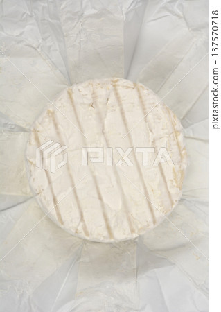 Top view of round blue cheese on white paper Top view of round blue cheese on white paper 137570718