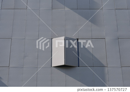 Minimalist gray metal facade with open window shutter Minimalist gray metal facade with open window shutter 137570727