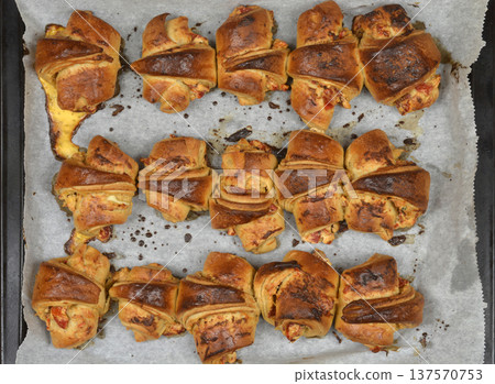 Baked rolls with roasted peppers on a baking sheet Baked rolls with roasted peppers on a baking sheet 137570753