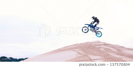 Sand, jump or athlete driving motorbike for action, adventure or fitness with performance or adrenaline. Speed, air or driver on motorcycle on dunes hill for training, exercise or race challenge Sand, jump or athlete driving motorbike for action, adventure or fitness with performance or adrenaline. Speed, air or driver on motorcycle on dunes hill for training, exercise or race challenge 137570804