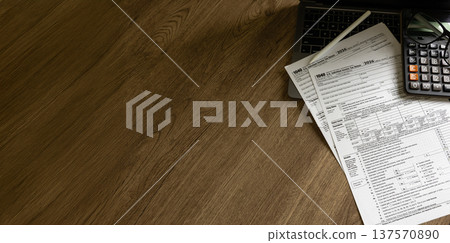 Financial paperwork tax form with calculator on workspace, accounting filing, income documentation, and corporate compliance process. Financial paperwork tax form with calculator on workspace, accounting filing, income documentation, and corporate compliance process. 137570890
