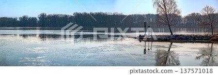 Reflections on the icy river Danube Reflections on the icy river Danube 137571018
