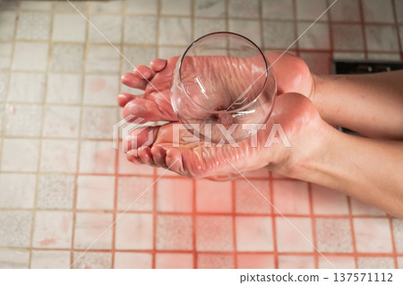 Foot fetish. A woman holds a wine glass in the shower. 137571112