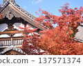 Historic temple buildings and autumn leaves against the blue sky 137571374