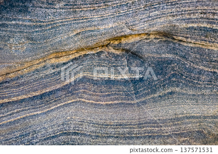 Close up blue color natural stone surface. Organic beautiful stone texture photo. 137571531