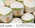 Fresh diamond cut young coconuts ready for drinking at market 137572912