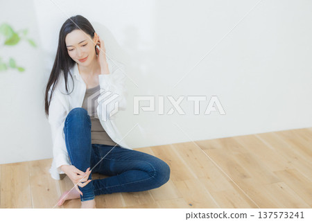 A woman with a white shirt A woman with a white shirt 137573241