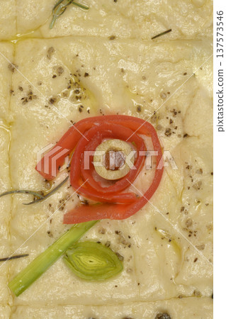 Close up of focaccia art with vegetable flower design 137573546