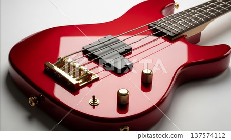 Red electric bass guitar with gold hardware chrome pickups and dark ebony fretboard closeup detail shot Red electric bass guitar with gold hardware chrome pickups and dark ebony fretboard closeup detail shot 137574112