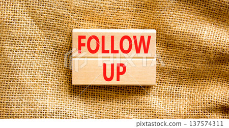 Follow up symbol. Concept word Follow up on beautiful wooden blocks. Beautiful canvas background. Business follow up concept. Copy space. Follow up symbol. Concept word Follow up on beautiful wooden blocks. Beautiful canvas background. Business follow up concept. Copy space. 137574311