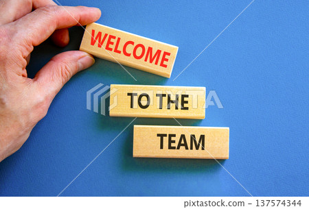 Support, help welcome to the team symbol. Concept words Welcome to the team on beautiful wooden blocks. Beautiful blue background. Businessman's hand. Business welcome to team concept. Copy space. Support, help welcome to the team symbol. Concept words Welcome to the team on beautiful wooden blocks. Beautiful blue background. Businessman's hand. Business welcome to team concept. Copy space. 137574344