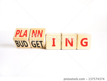 Budgeting and planning symbol. Concept words Planning to Budgeting on beautiful wooden cubes. Beautiful white table white background. Business, budgeting and planning concept. Copy space. Budgeting and planning symbol. Concept words Planning to Budgeting on beautiful wooden cubes. Beautiful white table white background. Business, budgeting and planning concept. Copy space. 137574374