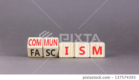 Communism or fascism symbol. Concept words Fascism to Communism on beautiful wooden cubes. Beautiful grey table grey background. Business historical and communism or fascism concept. Copy space. 137574393