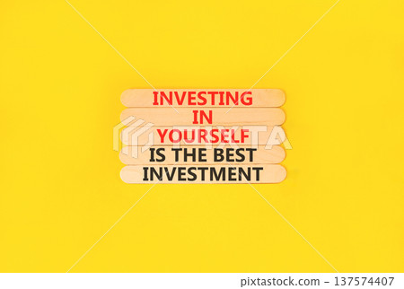 Investing in yourself symbol. Concept words Investing in yourself is the best investment on beautiful wooden sticks. Beautiful yellow background. Business investing in yourself concept. Copy space Investing in yourself symbol. Concept words Investing in yourself is the best investment on beautiful wooden sticks. Beautiful yellow background. Business investing in yourself concept. Copy space 137574407