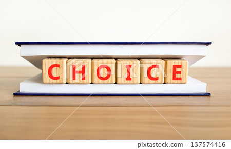 Choice symbol. Concept word Choice on beautiful wooden blocks in beautiful book. Beautiful wooden table white background. Business choice concept. Copy space. Choice symbol. Concept word Choice on beautiful wooden blocks in beautiful book. Beautiful wooden table white background. Business choice concept. Copy space. 137574416