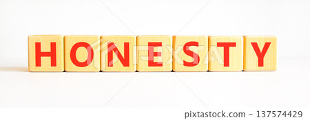 Honesty word symbol. Concept word Honesty on beautiful wooden blocks. Beautiful white background. Business honesty concept. Copy space. Honesty word symbol. Concept word Honesty on beautiful wooden blocks. Beautiful white background. Business honesty concept. Copy space. 137574429