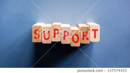 Support help word symbol. Concept word Support on beautiful wooden blocks. Beautiful blue background. Business support help word concept. Copy space. Support help word symbol. Concept word Support on beautiful wooden blocks. Beautiful blue background. Business support help word concept. Copy space. 137574435