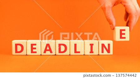 Deadline word symbol. Concept word Deadline on beautiful wooden blocks. Beautiful orange background. Businessman's hand. Business support help deadline word concept. Copy space. 137574442