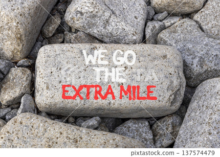 Support, help we go the extra mile symbol. Concept words We go the extra mile on beautiful grey stone. Beautiful grey stones background. Business we go the extra mile concept. Copy space. Support, help we go the extra mile symbol. Concept words We go the extra mile on beautiful grey stone. Beautiful grey stones background. Business we go the extra mile concept. Copy space. 137574479