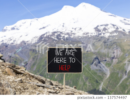 Support, help and we are here to help symbol. Concept words We are here to help on beautiful blackboard. Beautiful mountain Elbrus background. Business we are here to help concept. Copy space. Support, help and we are here to help symbol. Concept words We are here to help on beautiful blackboard. Beautiful mountain Elbrus background. Business we are here to help concept. Copy space. 137574497