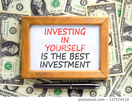 Investing in yourself symbol. Concept words Investing in yourself is the best investment on beautiful picture frame. Beautiful dollar bills background Business investing in yourself concept Copy space Investing in yourself symbol. Concept words Investing in yourself is the best investment on beautiful picture frame. Beautiful dollar bills background Business investing in yourself concept Copy space 137574519
