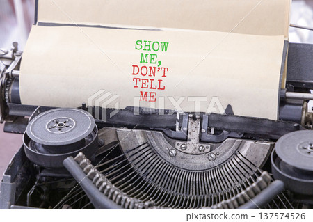 Tell or show symbol. Concept words Show me, do not tell me typed on old retro typewriter. Beautiful white background. Business tell or show concept. Copy space. Tell or show symbol. Concept words Show me, do not tell me typed on old retro typewriter. Beautiful white background. Business tell or show concept. Copy space. 137574526