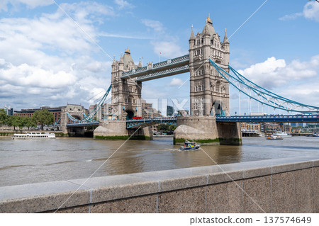 Tower Bridge over the River Thames represents a popular travel destination and sightseeing location in London. Tower Bridge over the River Thames represents a popular travel destination and sightseeing location in London. 137574649
