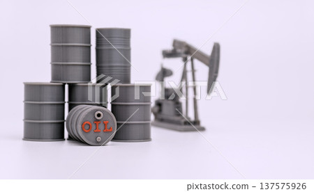 Stacked Oil Barrels and Pumpjack Isolated on White 137575926