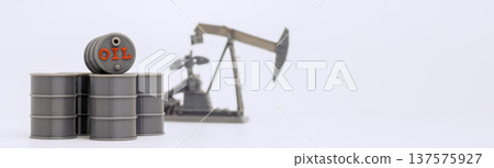 Oil Barrels with Copy Space and Pumpjack Industry Concept 137575927