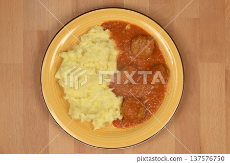 Meatballs in tomato sauce with mashed potatoes Meatballs in tomato sauce with mashed potatoes 137576750