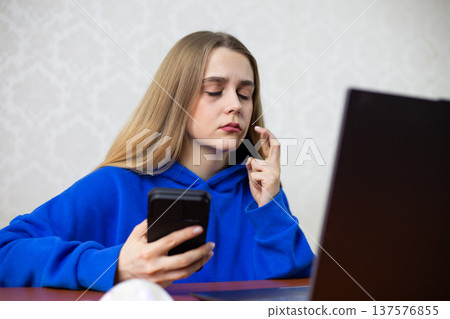 Girl crypto trader closes eyes and crosses fingers, hoping her leveraged position survives. She fears liquidation while monitoring Bitcoin on laptop. High risk investment and digital finance concept Girl crypto trader closes eyes and crosses fingers, hoping her leveraged position survives. She fears liquidation while monitoring Bitcoin on laptop. High risk investment and digital finance concept 137576855