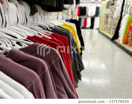 Colorful Clothes On Hangers In Clothing Store 137576934