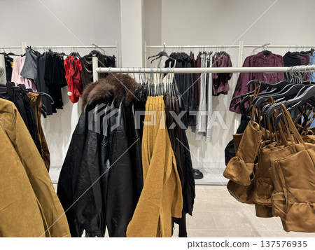 Fashion Boutique Interior With Clothing Racks And Bags 137576935