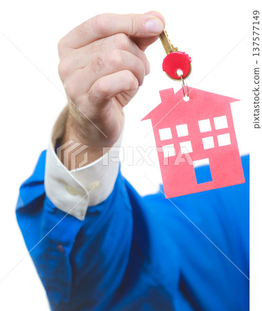 Man hand holding home keys Man hand holding home keys 137577149