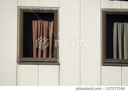 The shadows of the curtains seen through the window and the texture of the white wall The shadows of the curtains seen through the window and the texture of the white wall 137577160