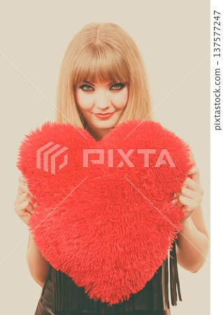 Woman gorgeous girl holding red heart love symbol Woman gorgeous girl holding red heart love symbol 137577247