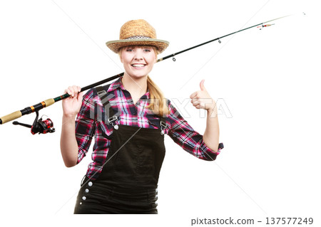 Happy woman in sun hat holding fishing rod 137577249
